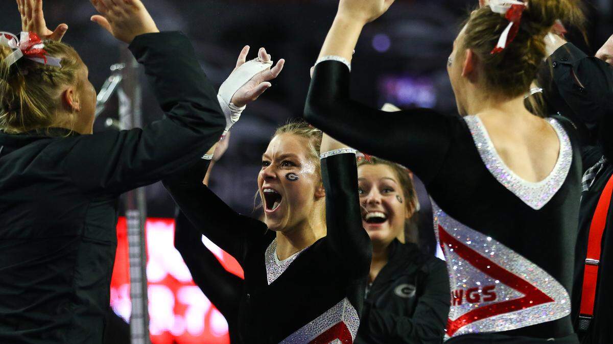 Georgia’s Rachel Dickson celebrates with her teammates during a gymnastics meet between the University of Georgia and University of Arkansas in Stegeman Coliseum in Athens, Ga., on Friday, Feb. 1, 2019.