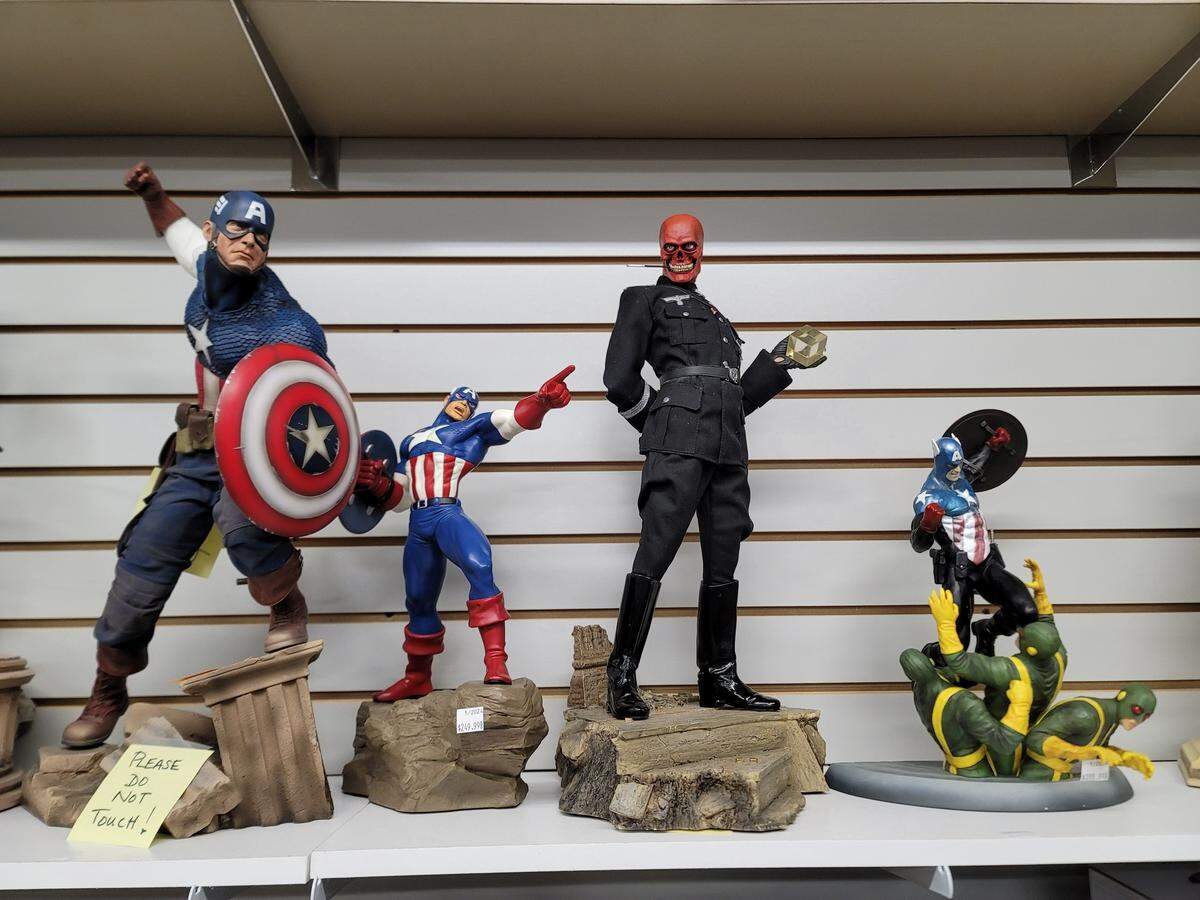 Comic book statues stand on display at Macon comic store Fanboy Collectibles & Comics.