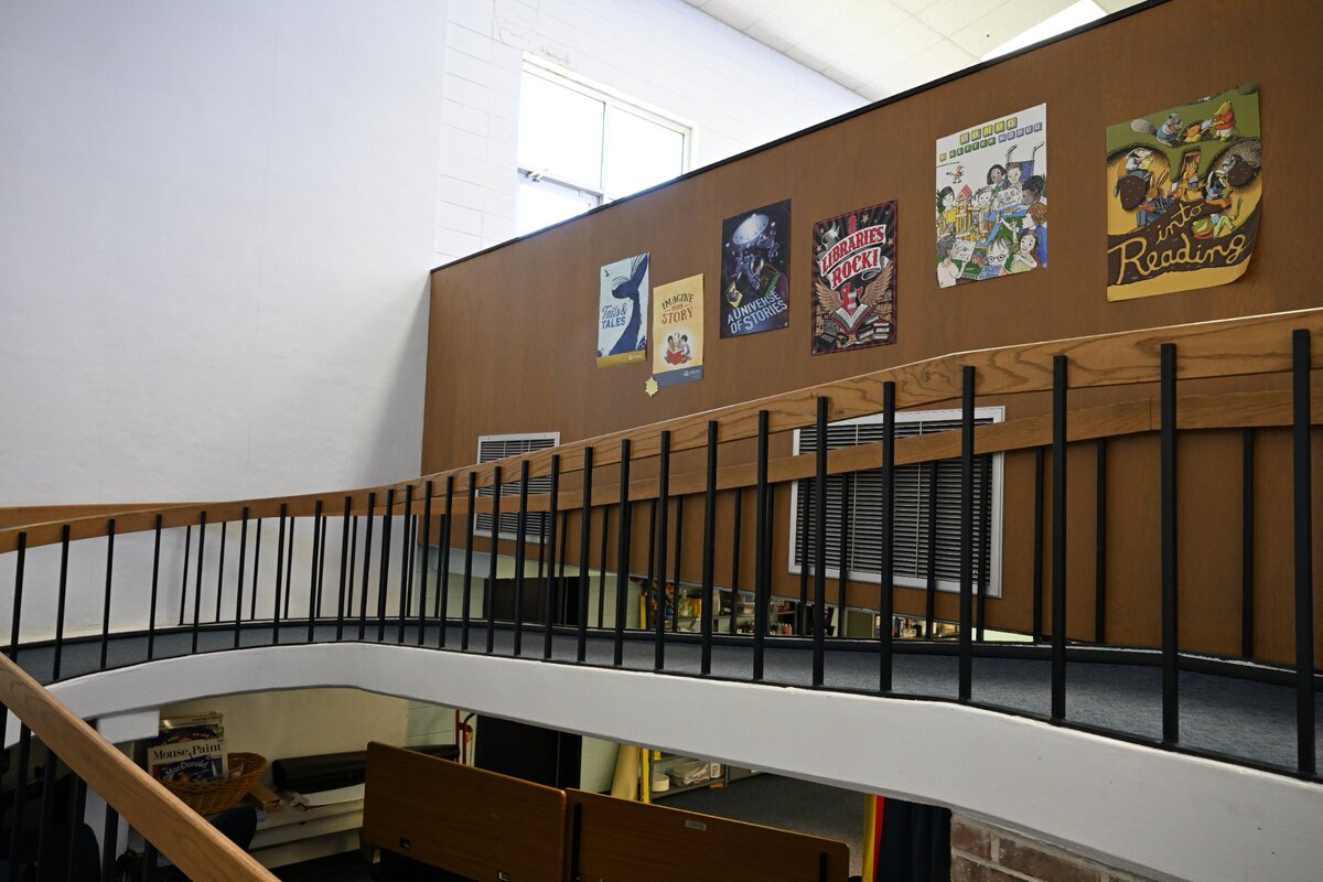 A ramp down to the lower level sits inside of the Shurling Branch Library on Friday, April 18, 2025, in Macon, Georgia. The ramp leads down to a lower event space, but is not ADA compliant.