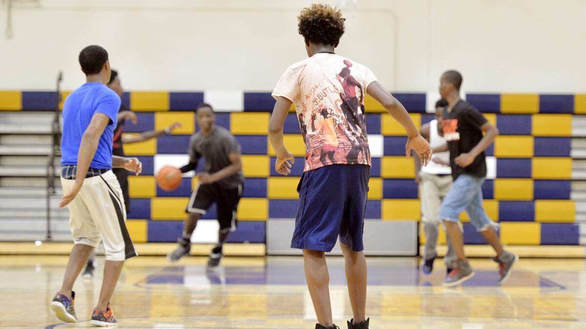 Neighborhood youth play a game of basketball at Rosa Jackson Center in August during a free play period at the center.