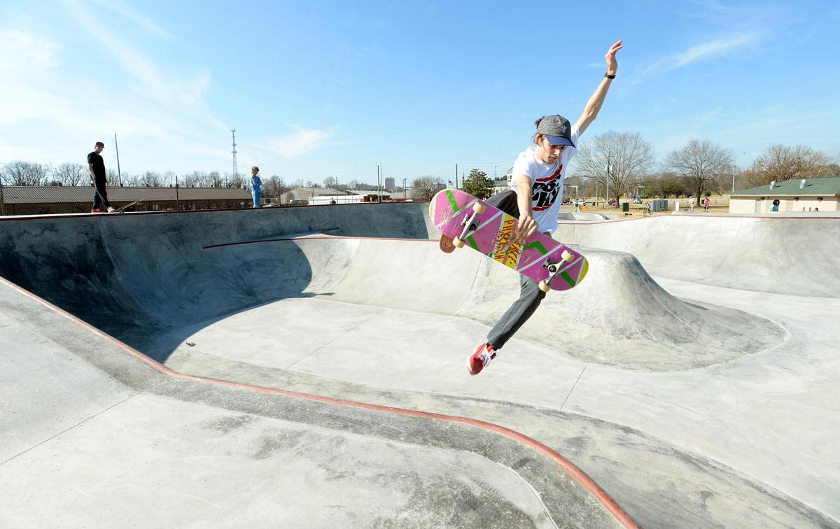 Benjamin Arthur of Macon performs a nollie big spin to 50-50 trick on his skate board at the new competition bowl at Central City Park Thursday. Arthur said he began skate boarding at the old indoor center at the park and has enjoyed skating at the best parks in Georgia. He said the new one here is one of the best he’s ever used and he says other boarders agree on the point.