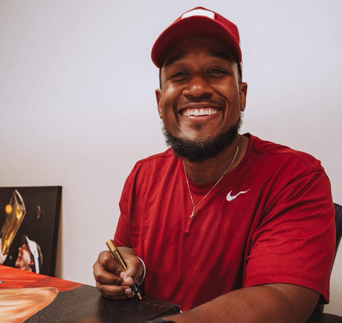 Artist Caleb Brown says his love of college football inspired him to create the Georgia Bulldogs’ championship paintings.