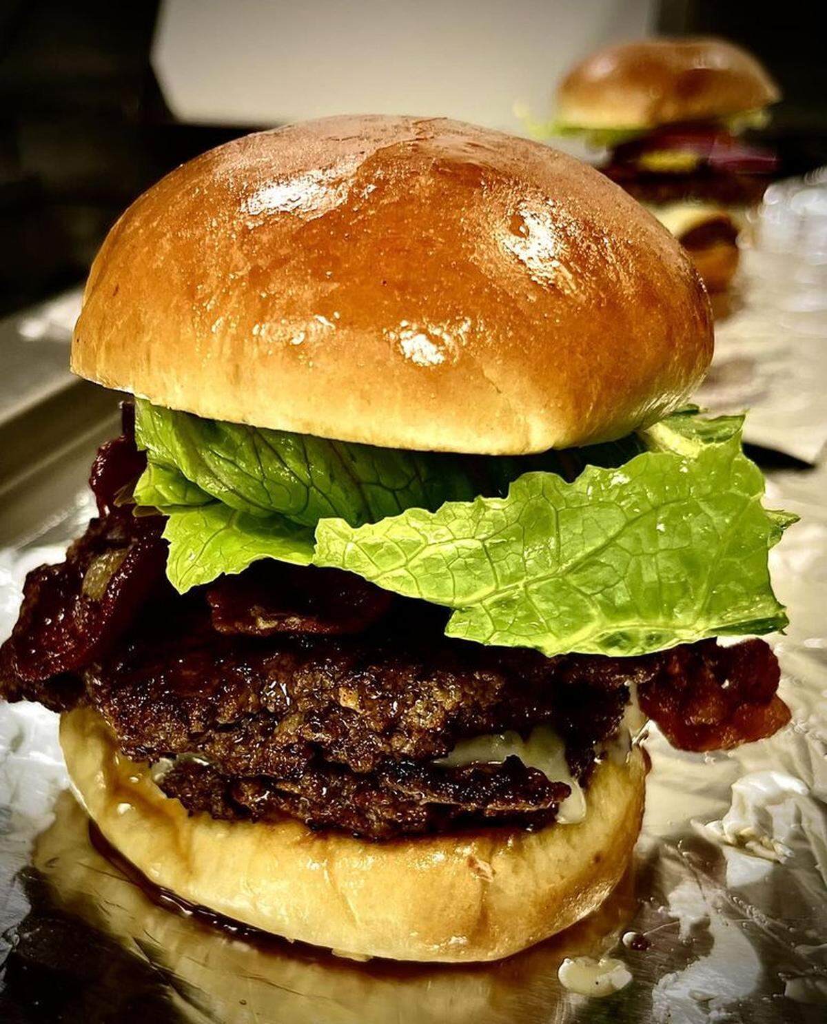 “Keene’s Famous Steak Burger” at Keene’s Kafe in Macon. The menu describes it this way, “two Certified Angus Beef patties cooked to perfection layered with muenster cheese, topped with bacon and placed on a brioche bun. Served with lettuce, tomato, red onion, mustard and ketchup.”