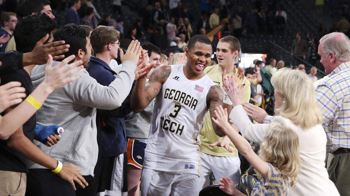 Georgia Tech guard Marcus Georges-Hunt (3) celebrates with fans after Georgia defeated Clemson on Tuesday.
