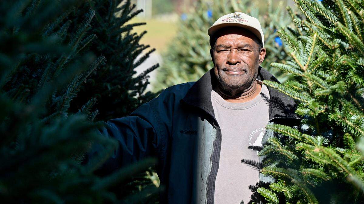 Larry Stephens has been working for Slaughter’s Christmas Trees at the Macon State Farmers Market since 1980.