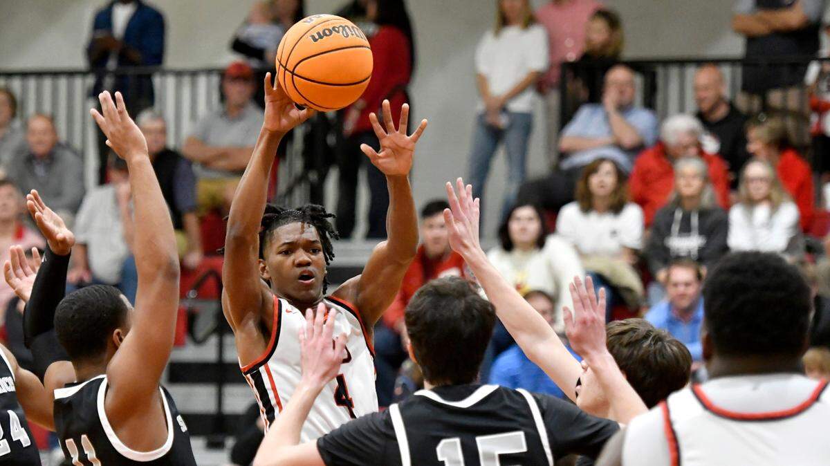 FPD’s Jay King (4) passes the ball to a teammate is fouled by St. Francis’ Jase McCullough (11) during the Vikings’ 64-53 win over St. Francis to advance to the GHSA 1A (Private) Final Four.