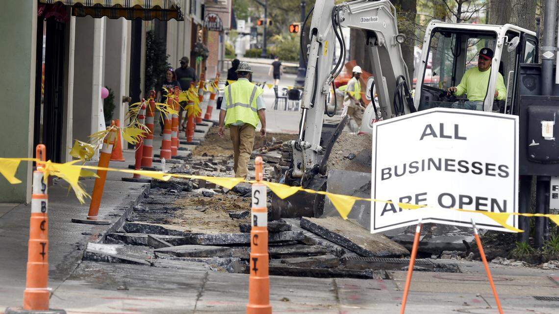 Contractors with Stafford Builders & Consultants tear up the concrete sidewalks Monday afternoon on Cherry Street in downtown Macon as part a new streetscape project.