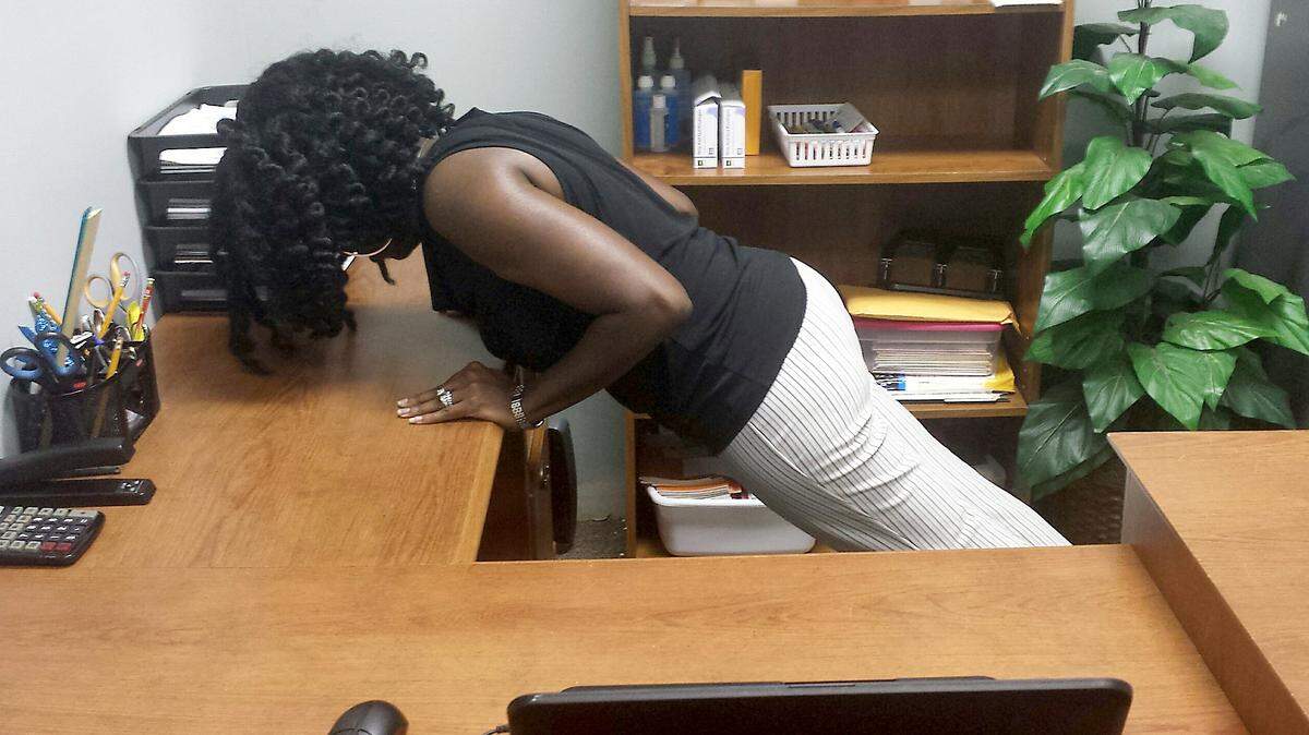 SPECIAL TO THE TELEGRAPHPerforming a few push-ups off of your desk at different times during the workday is a great way to counteract the negative effects of sitting for hours at a time.