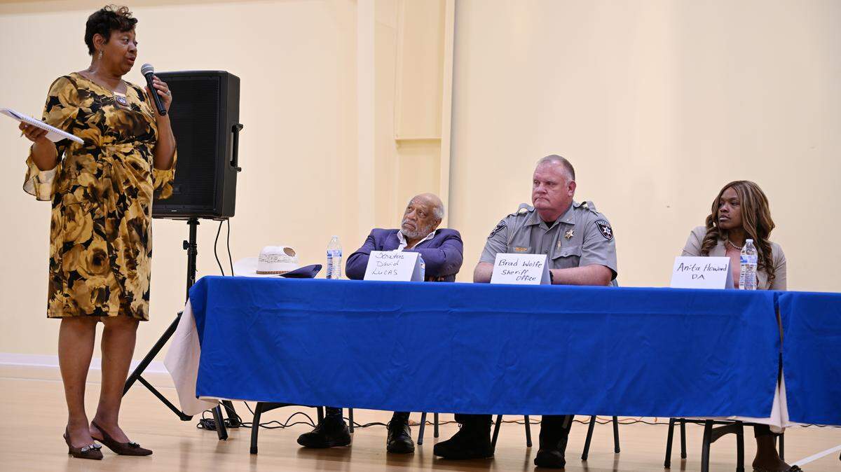 Macon Bibb NAACP president Gwenette Westbrooks (far left) speaks to town hall speakers State Senator David Lucas (left), Major Brad Wolfe of the Bibb County Sheriff’s Office (right) and Macon Judicial Circuit District Attorney Anita Howard during an NAACP Town Hall on Thursday, Sept. 11, 2025, at Union Baptist Church in Macon, Georgia. The town hall addressed problems at Bibb County Jail, community civic involvement and other issues. 