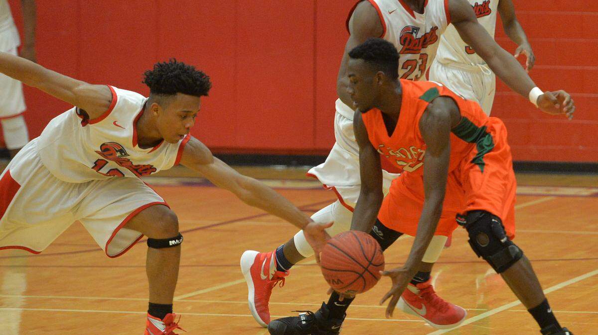 Southwest's Nick Hargrove (10) makes the steal on Canyon King (23) of Rutland right during first half action.