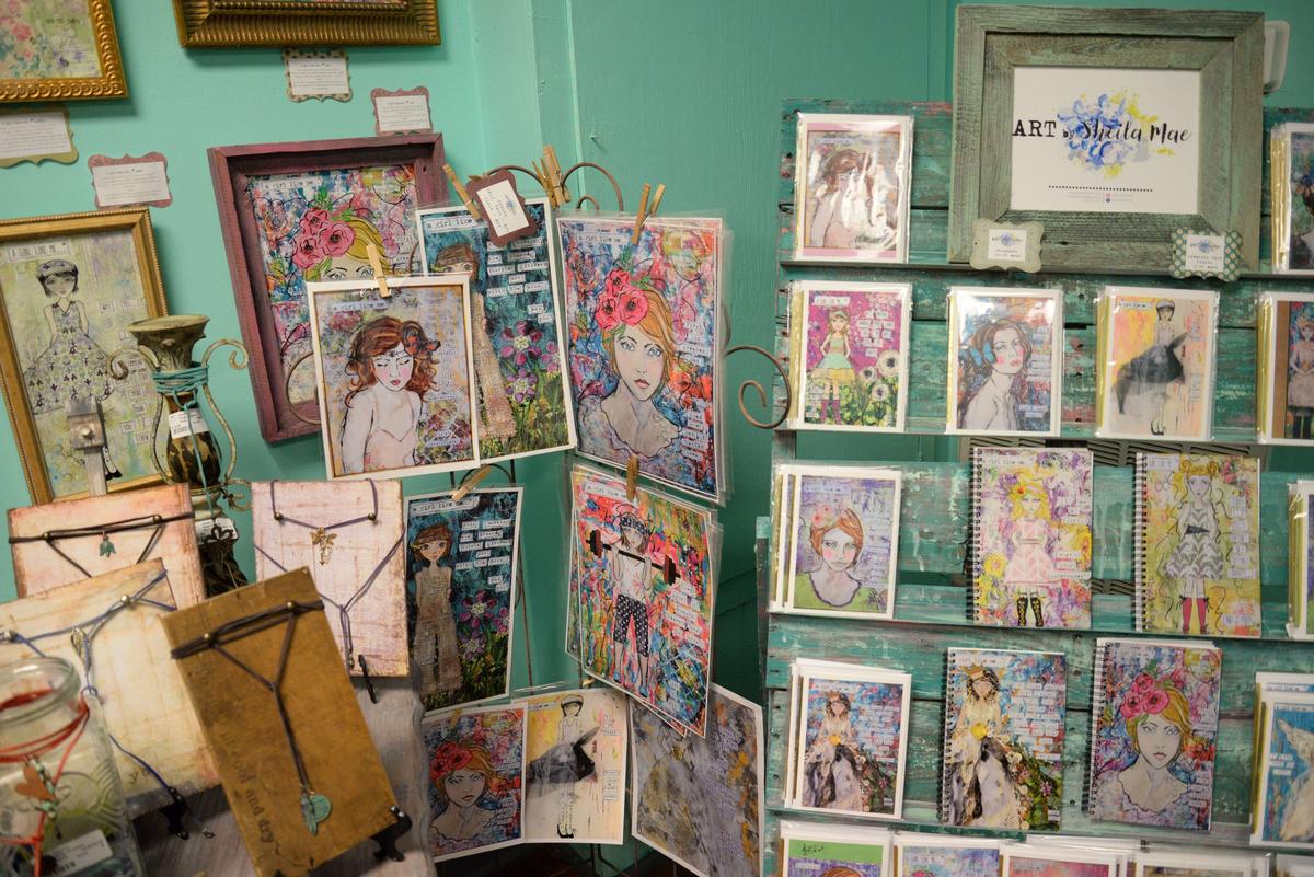 Art by Sheila Mae is displayed for sale in the Macon Exchange in downtown Macon. The Exchange has 19 different vendors that sell everything from jewelry to soaps to sweet snacks. It will be open Thursday-Sunday through December.