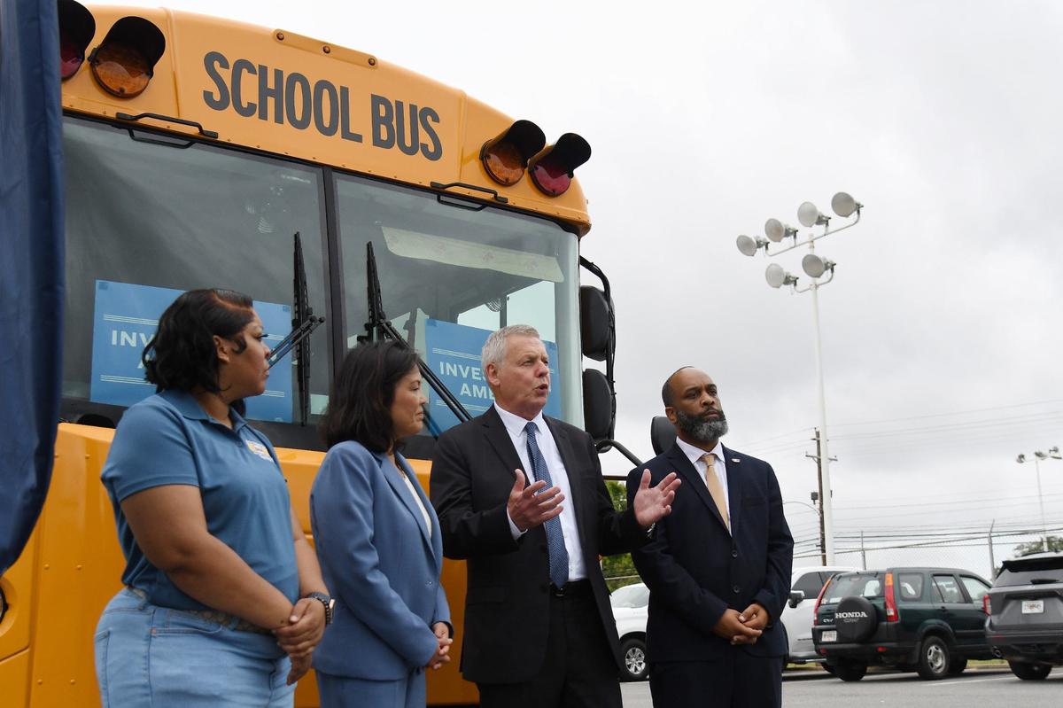 From left to right: Blue Bird employee Dee Thomas, Acting Secretary of Labor Julie Su, Blue Bird CEO Phil Horlock and United Steelworkers District 9 staff representative Alex Perkins speak to press after celebrating Blue Bird’s union contract on Friday, July 19, 2024, at the Blue Bird manufacturing plant in Fort Valley, Georgia. Blue Bird electric bus manufacturing workers ratified their first union contract in May, joining United Steelworkers and securing wage increases, safety improvements and more employee benefits.