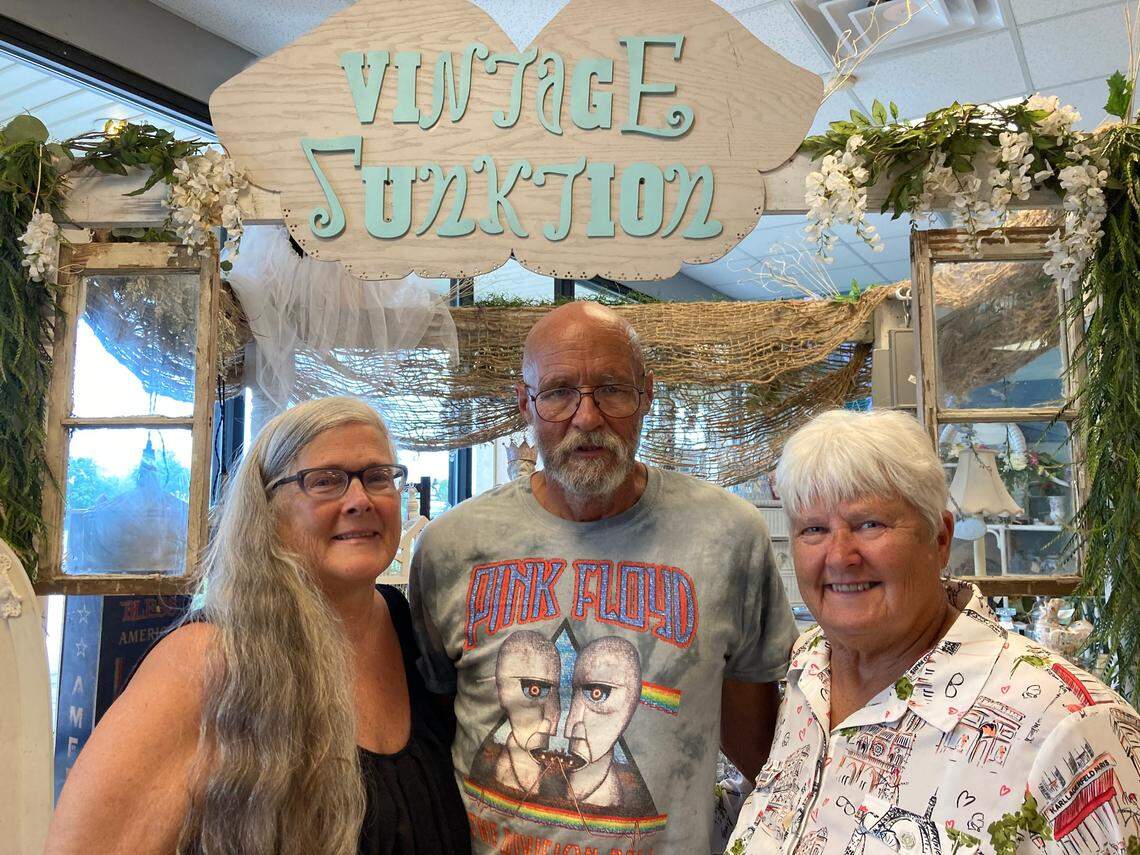 Sisters Dana Henderson, left, and Vicki Schmick, right, recently opened Vintage Junktion at 1275 South Houston Lake Road in Warner Robins with the help of Henderson’s husband, Bill Henderson, center.