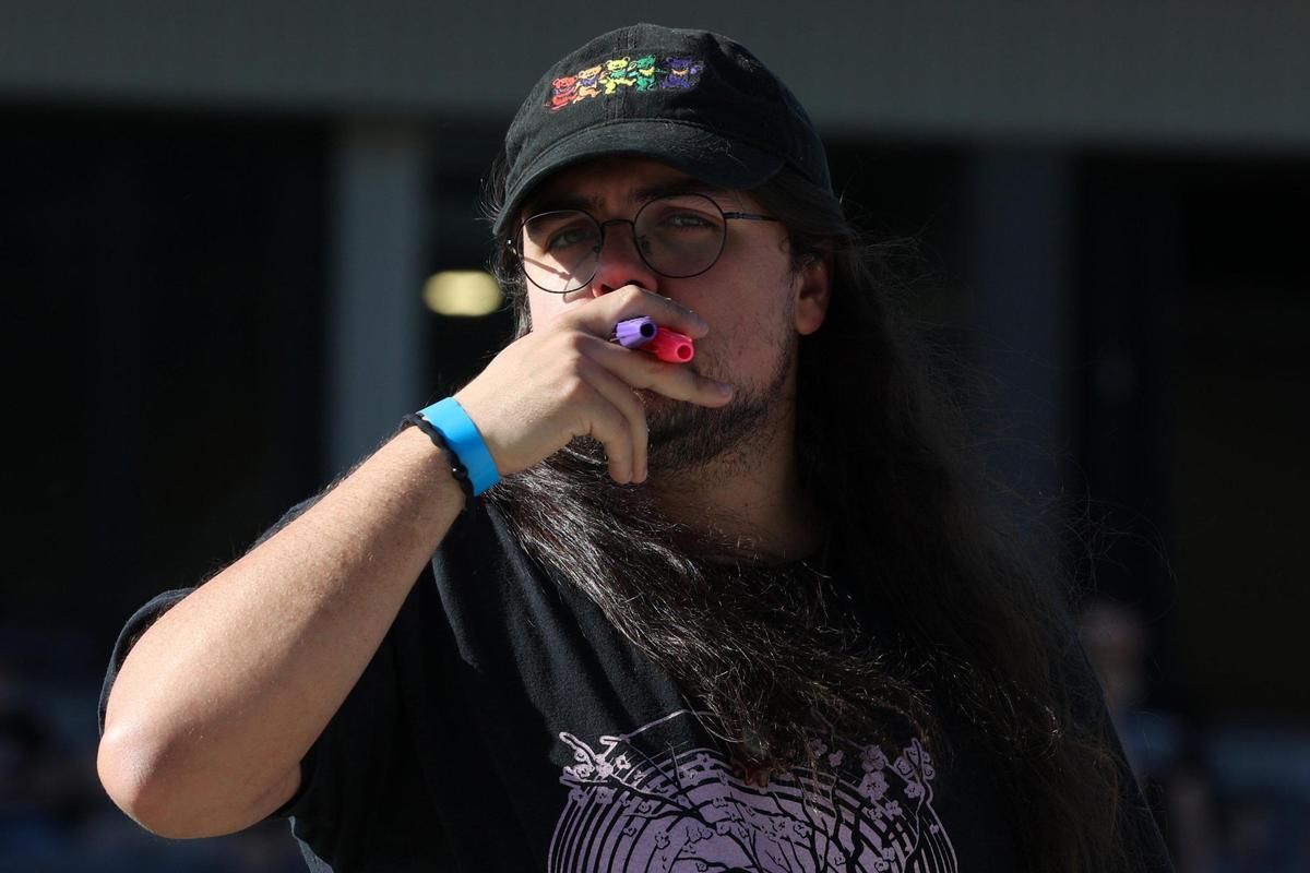 Brady Gonzalez holds two kazoos before the start of the Guinness World Record attempt for largest kazoo ensemble on Friday, March 28, 2025, at the Atrium Health Amphitheater in Macon, Georgia. Over 1,000 participants came out for the event, but their third record attempt failed to meet the mark for the record.
