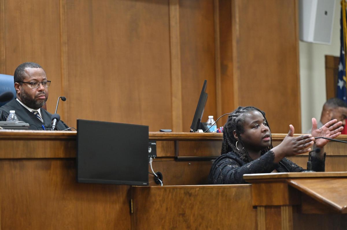 Macon Judicial Circuit Judge Jeffrey Monroe (left) listens as Lateesha Riddle testifies during her immunity hearing at the Bibb County Courthouse on Monday, Jan. 27, 2025 in Macon, Georgia. Judge Monroe denied Riddle’s motion for immunity from prosecution on Monday after hearing multiple testimonies in a 2022 case where Riddle fatally shot her husband, while Riddle said she acted in self-dense. The case will now go to a jury trial.
