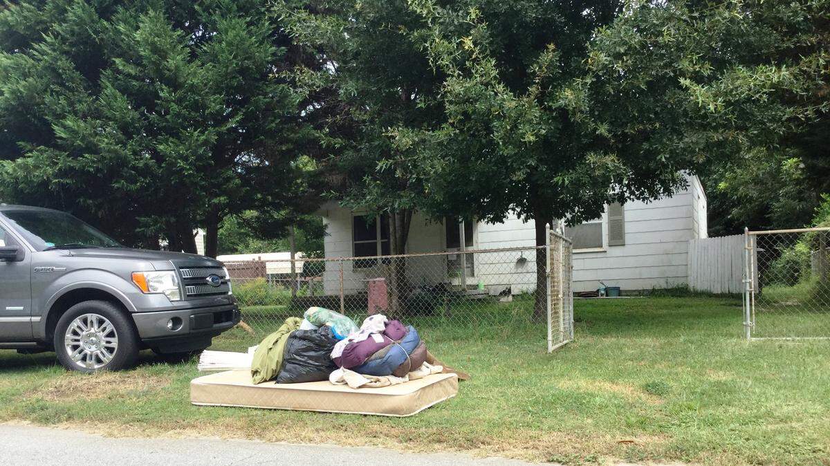 A mattress and cat beds are discarded among the trash of a Charles Circle home where 86-year-old Martha Fowler has been living with 34 cats and one dog.  The city limits the number of cats and dogs per household.
