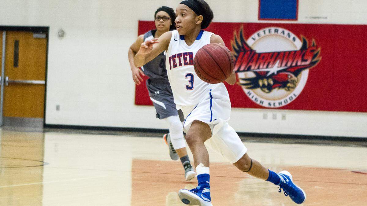 Veterans Kya Cochran (3) drives to the lane against Redan in the second round of the GHSA Class AAAA basketball playoffs.