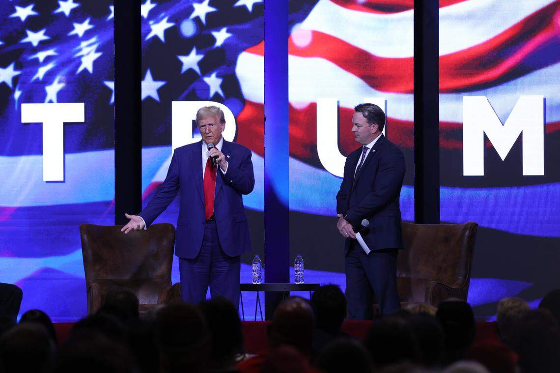 Republican presidential nominee Donald Trump addresses the crowd with Georgia Lt. Gov. Burt Jones (right) during the Believers and Ballots Faith Town Hall on Wednesday, Oct. 23, 2024, at Christ Church Zebulon in Zebulon, Georgia. In the first of two Georgia campaign events on the day, Trump took questions from Zebulon community members.