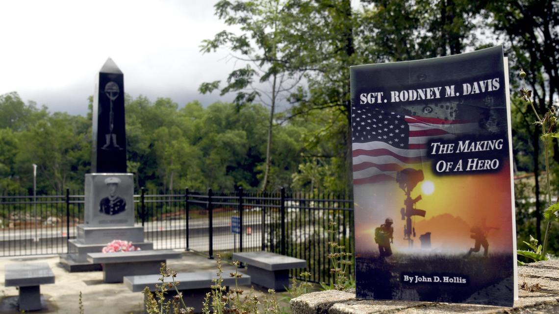Author John Hollis' book "The Making of a Hero" is about Macon's Medal of Honor recipient Sgt. Rodney Davis. The book is shown next to Davis' monument at Linwood Cemetery.