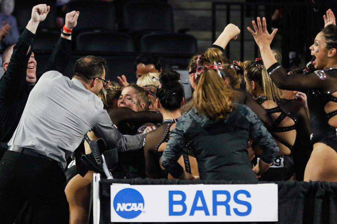 Georgia’s Marissa Oakley is celebrated after scoring a perfect 10 on bars during the Gymnastics NCAA Regional in Athens, Ga., on Saturday, Apr. 6, 2019.