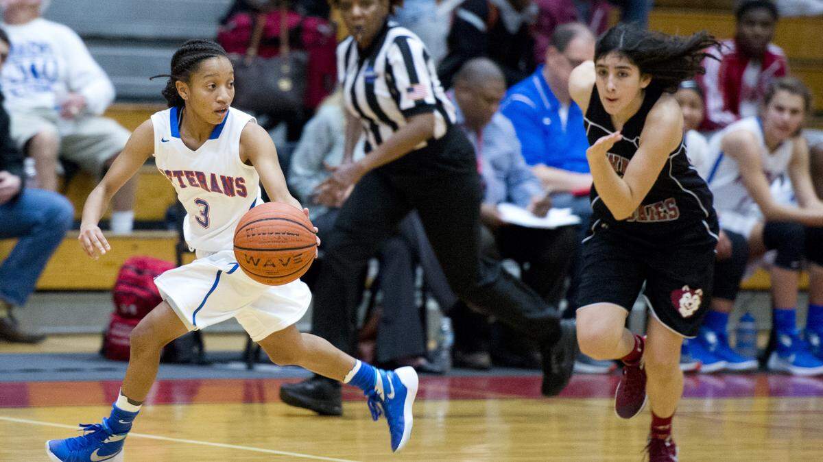 Veterans guard Kya Cochran (3) drives the ball up court after stealing the ball during their game at Howard Tuesday night.