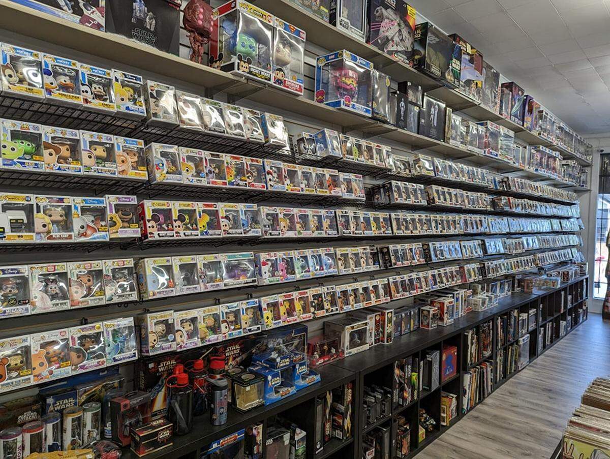 Collectibles line the walls of Fanboy Collectibles & Comics located in Macon.