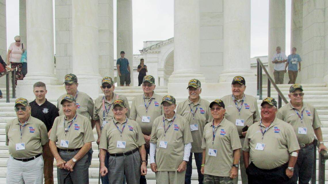 War veterans from Middle Georgia pose for a photo with Cameron Payne, back left, an honor guard at the Tomb of the Unknown Soldier,  after the group visited the tomb on Sept. 8. It was part of a free tour of Washington war monuments arranged by the newly formed Middle Georgia Honor Flight.