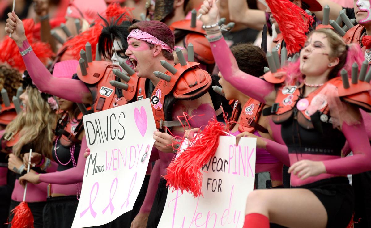 Members of the UGA Spike Squad cheer on the Bulldogs while showing support for Arkansas State head coach Blake Anderson. Anderson’s wife Wendy died recently of breast cancer.