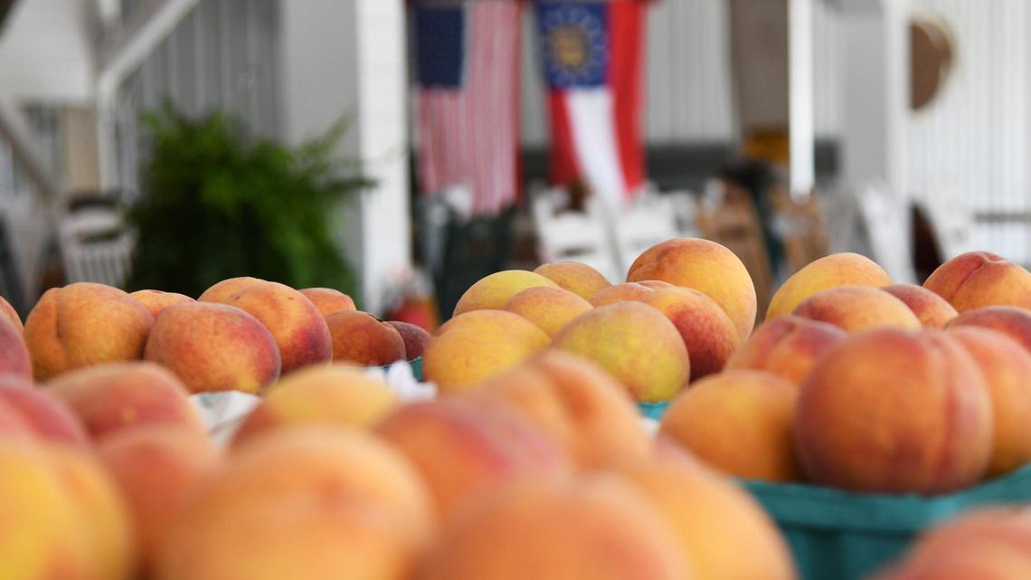 Peaches from Dickey Farms sit in baskets in the shop at Dickey Farms on Wednesday, July 3, 2024, in Musella, Georgia. Dickey Farms is the oldest, continuously operating peach packinghouse in Georgia and offers tours and sells homemade goods and produce in their shop.