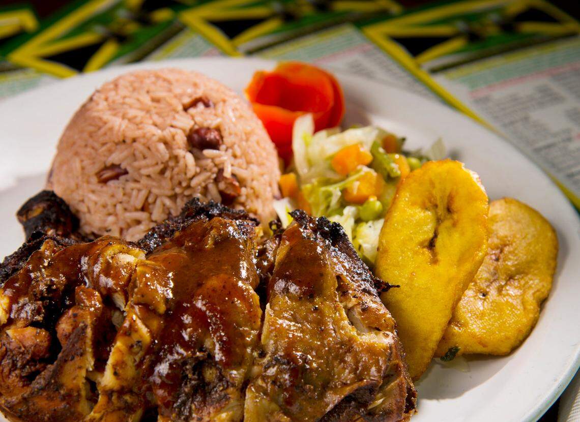 JASON VORHEES/THE TELEGRAPH Macon, GA, 01/04/2016: Jerk chicken with rice and beans, seemed vegetables and fried plantains at J&F Caribbean Delight.