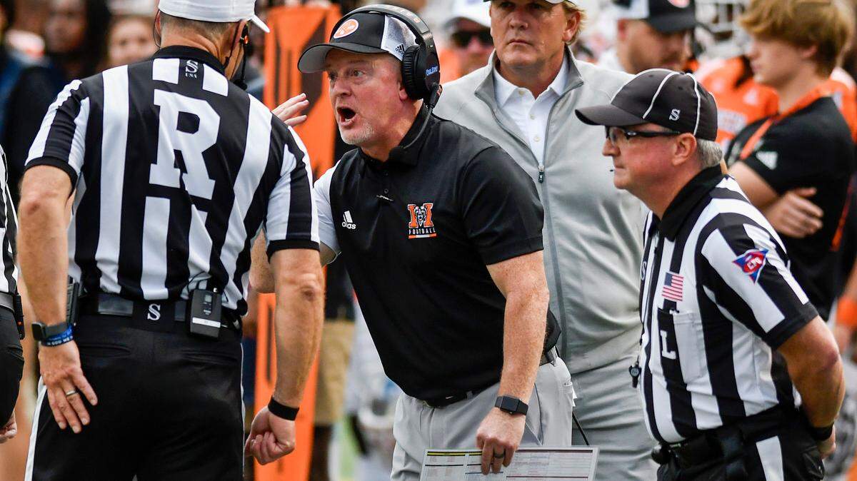 Mercer head coach Drew Cronic argues with an official during the Bears’ 23-13 loss to Furman Saturday.