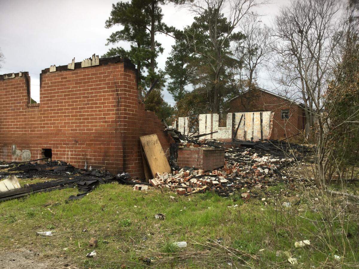 Macon-Bibb County fire investigator Lt. Ben Gleaton said someone set fire to this Fort Hill house on Short Street at Clark’s Lane before 4:30 a.m. Tuesday.