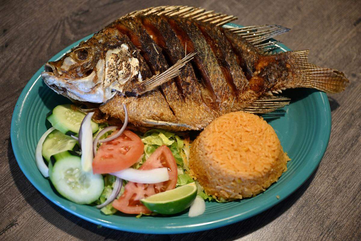 Mojarra Frita sits on a plate inside of Cozumel Mexican Grill on Wednesday, April 23, 2025, in Perry, Georgia. The dish features a whole deep-fried marinated fish and is served with a side of rice, tortillas and vegetables. 
