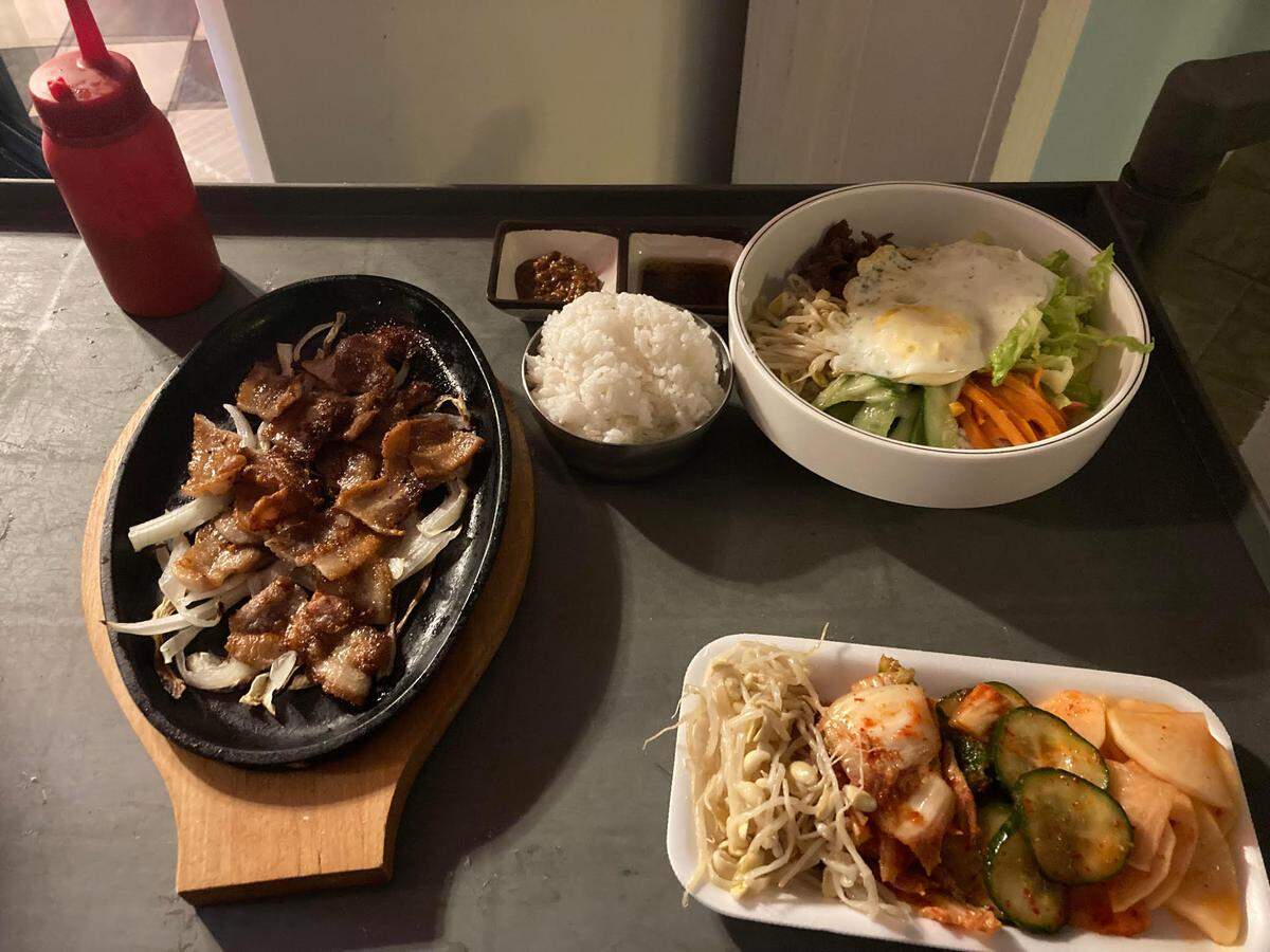 A cart of food at the Kimchi Factory is rolled to a dining table. The Korean restaurant is shutting its doors permanently.