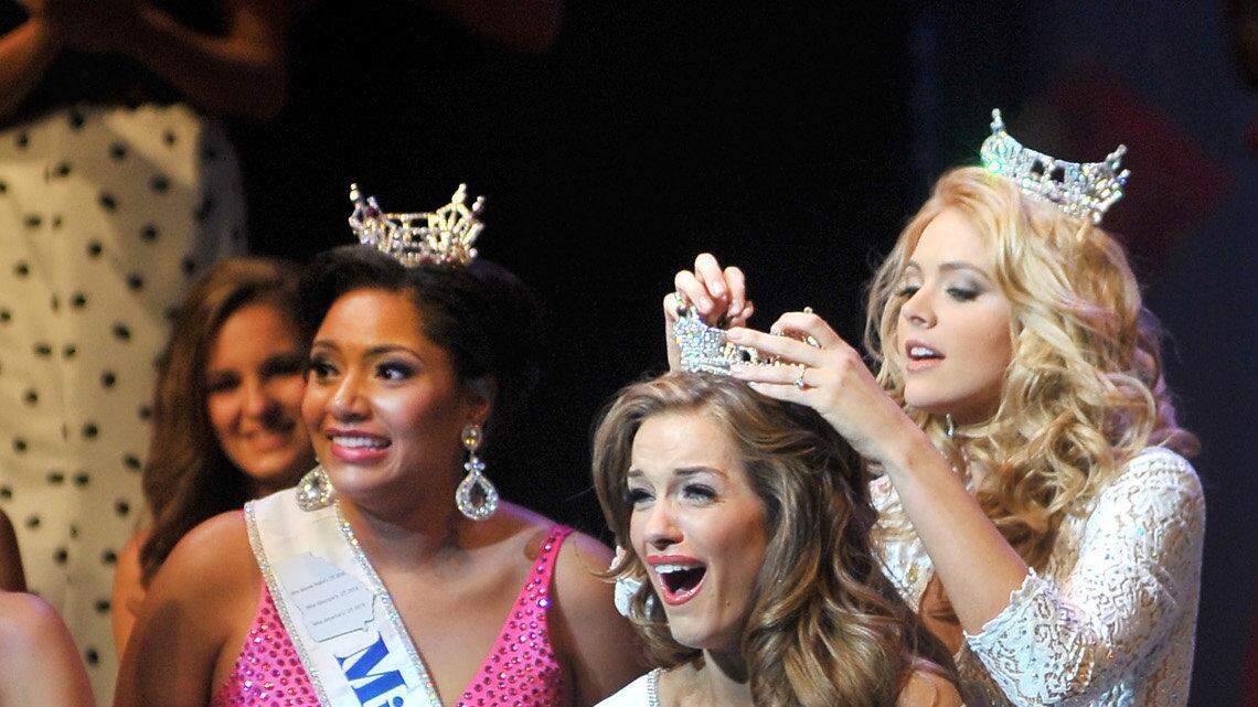 Miss Warner Robins Betty Cantrell is crowned Miss Georgia 2015 by Miss Georgia 2014 Maggie Bridges Saturday night.