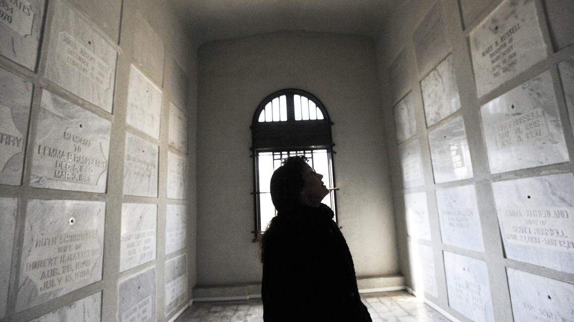 Suzanne Doonan scans the walls of the Hart Mouseleum searching for the burial crypt of Chester Burge who was charged with his wife's murder in 1960 and dead himself less than three years later. His remains were brought to the building for interment under the cover of night, unceremoniously, and have never been marked.