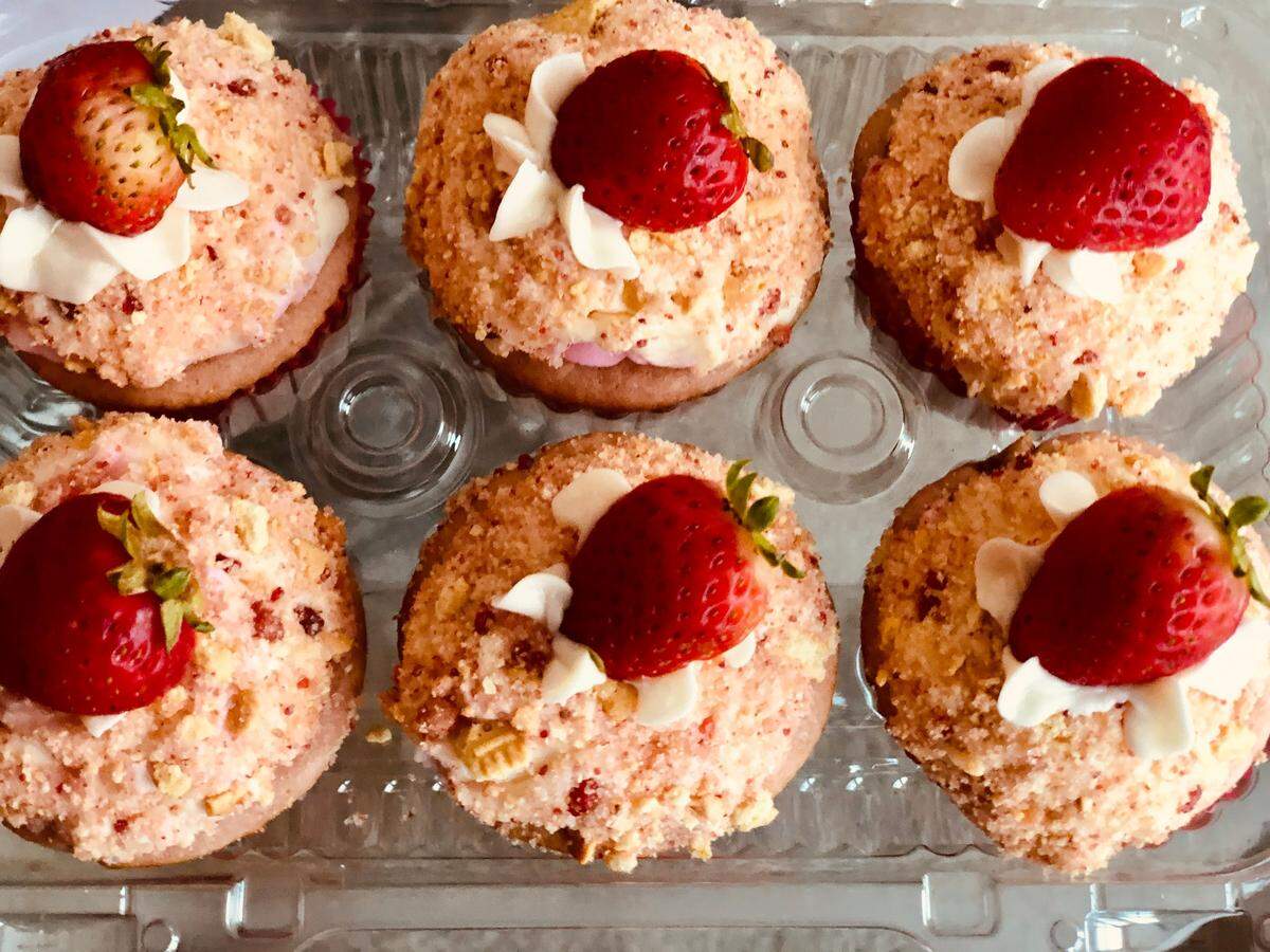 Strawberry Shortcake Crunch Cupcakes from Sweet Rain Vegan Bakeshop. “Our delicious strawberry cupcakes iced with vanilla buttercream and topped with our specialty strawberry crunch mixture.”