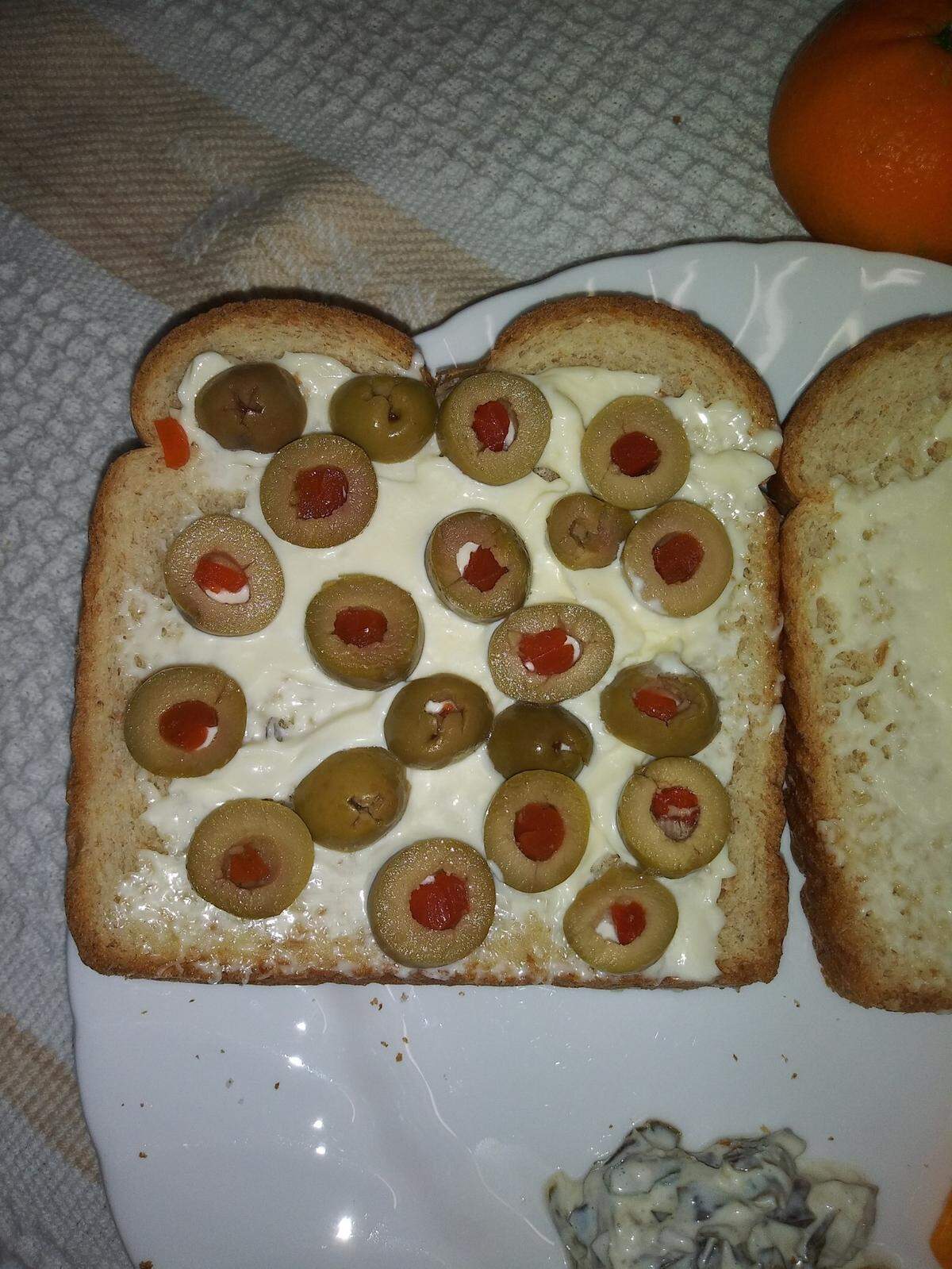 Dennis Herbert took this photo of an olive sandwich he made, later apologizing that the olives were “not arranged in straight lines as they should be.”