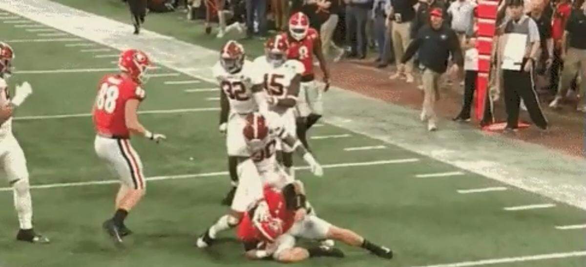 Alabama linebacker Mack Wilson shoved Georgia quarterback Jake Fromm's head after making a tackle.