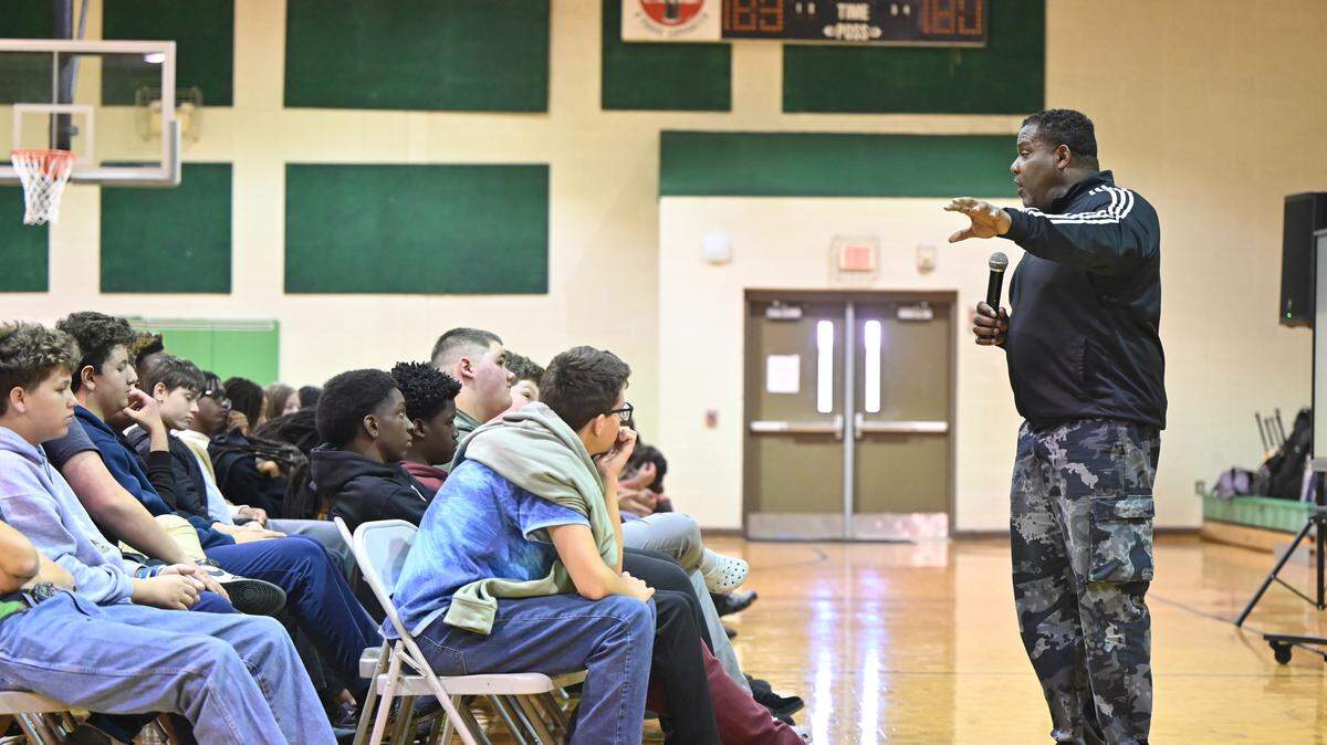 Reclaiming Ground Inc. president Willie Raines (right) speaks to Byron Middle School eighth grade students for an annual anti-bullying assembly in the gymnasium on Thursday, April 9, 2026, in Byron, Georgia. Byron Middle School hosted Raines’ Combat Bullying Tour which stressed suicide prevention and anti-bullying. 
