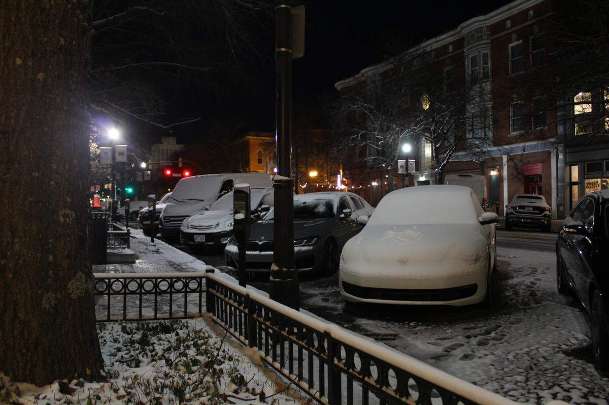 A coat of snow covered vehicles and the pavement on Cherry Street in downtown Macon, Ga. around 6 a.m. Wednesday, Jan. 22, 2025, following a winter storm Tuesday.