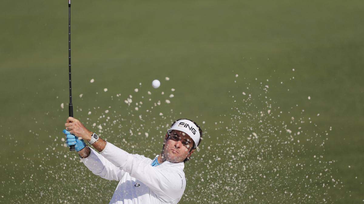 Bubba Watson hits out of a bunker on the second hole during Friday's second round of the Masters. He finished at 9-over-par 297.
