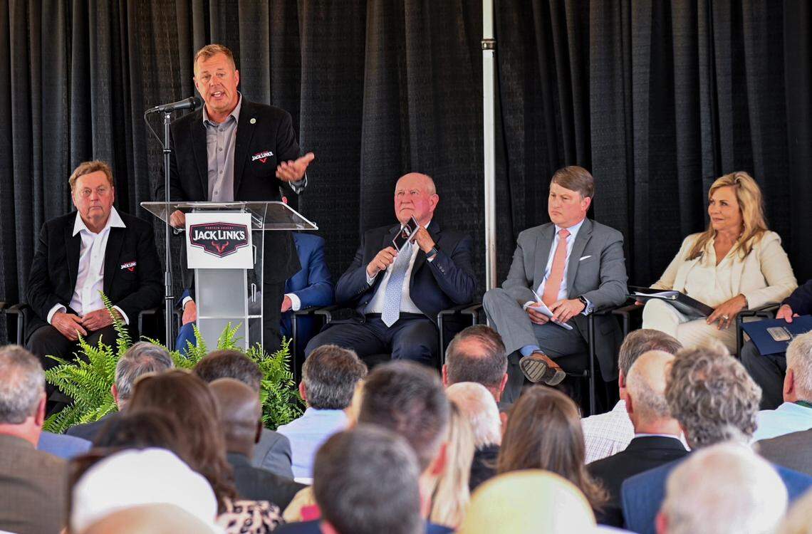 Troy Link, president and CEO of Jack Link’s Protein Snacks speaks Tuesday afternoon during a groundbreaking for a new $450 million Jack Link’s processing facility in Perry. His father Jack Link (far left) founded the company in 1985.