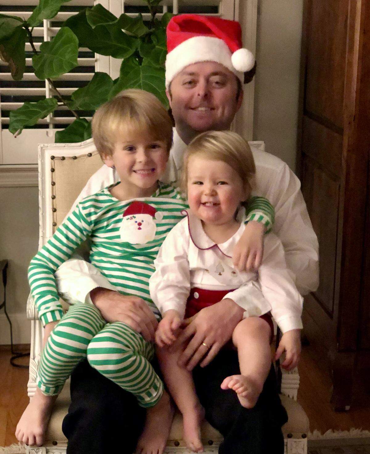 Scott Chalkley poses for a photo with sons Hughes, 5, and Weller, 19 months.