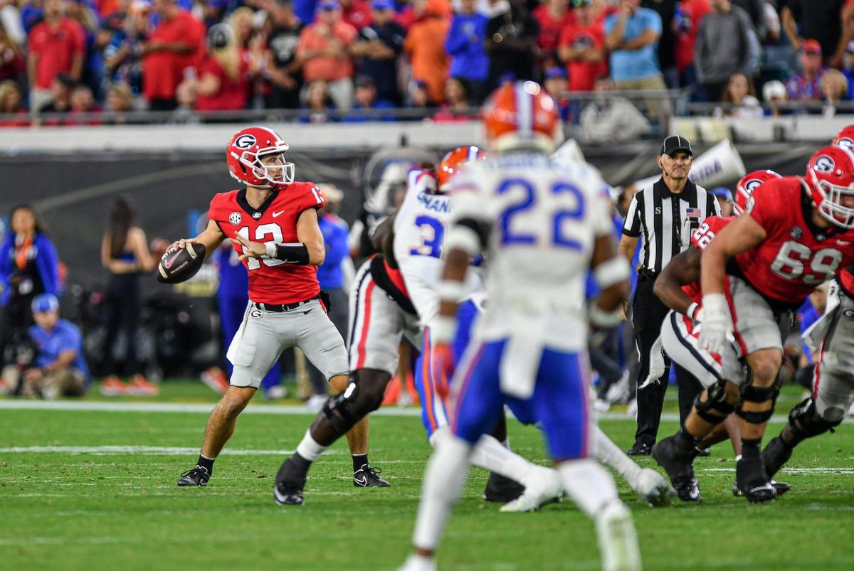 Georgia quarterback Stetson Bennett throws long in action Saturday against the Florida Gators.