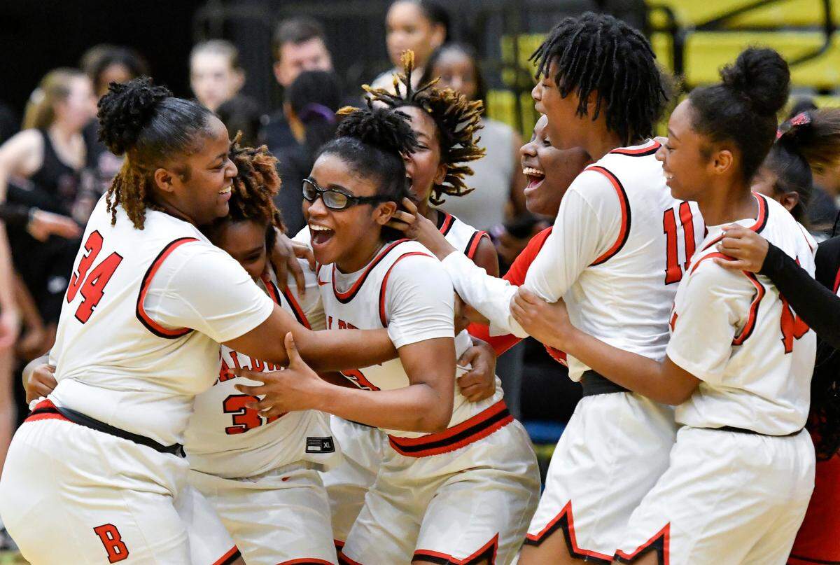 Baldwin players celebrate their 58-45 GHSA 4A semifinal win over Holy Innocents’ Saturday at Fort Valley State. Baldwin will play Griffin Wednesday, March 8 at 5 p.m. at the Macon Coliseum.