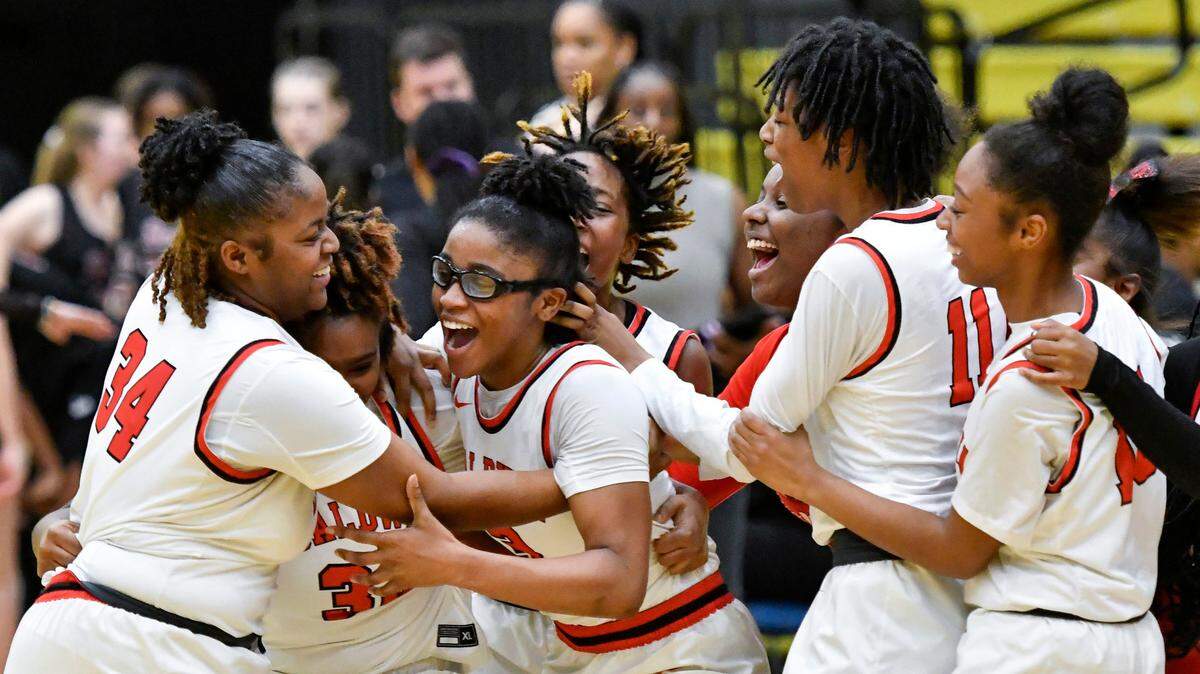 Baldwin players celebrate their 58-45 GHSA 4A semifinal win over Holy Innocents’ Saturday at Fort Valley State. Baldwin will play Griffin Wednesday, March 8 at 5 p.m. at the Macon Coliseum.