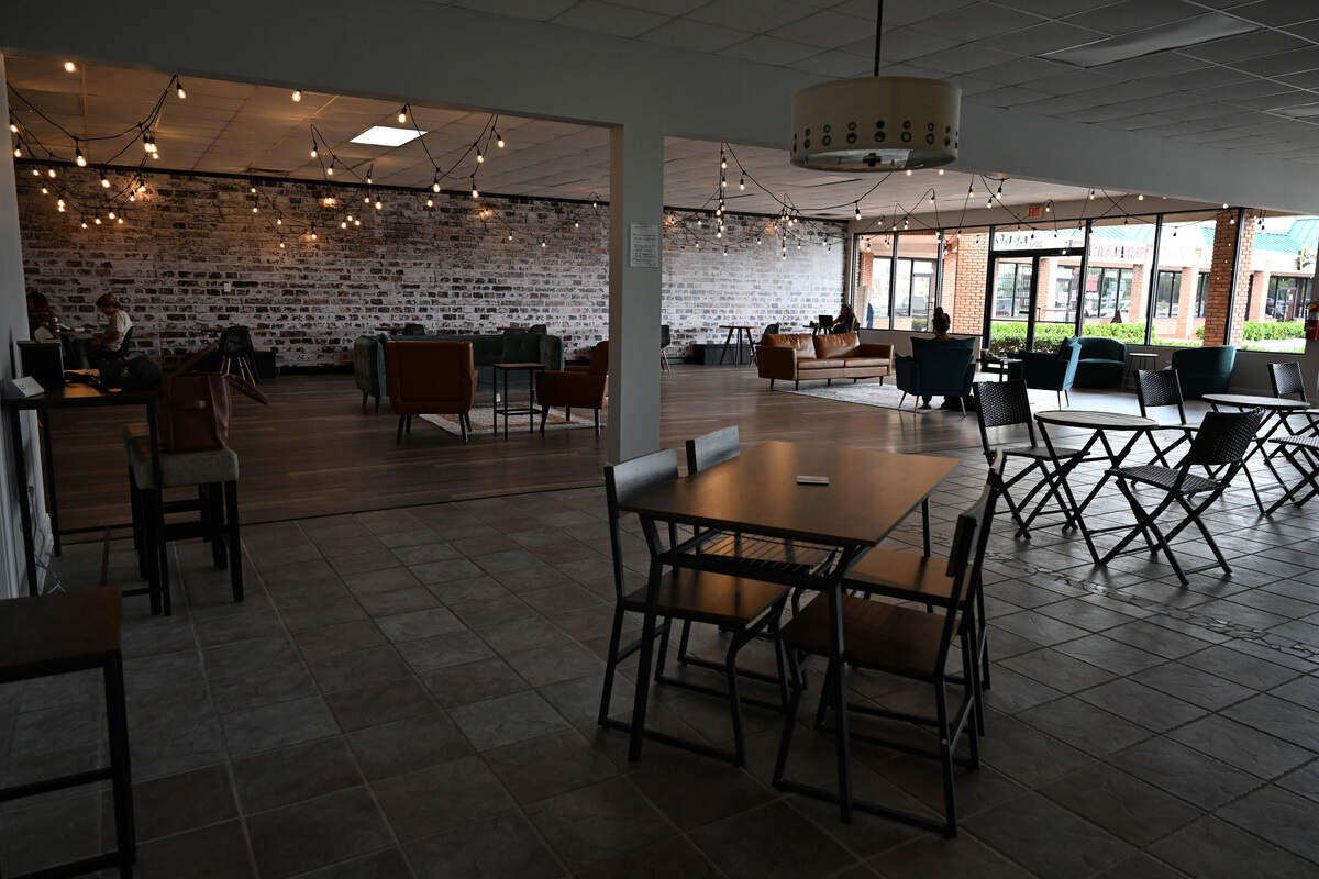 Customers sit inside of the new “third space” of Little Light Coffee Co. on Wednesday, July 30, 2025, in Warner Robins, Georgia. The new space, which officially opened Aug. 1, is connected to the original shop.