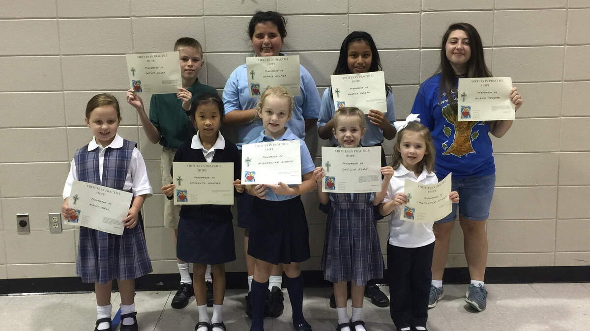 SPECIAL TO THE SUN NEWSSacred Heart Catholic School students were honored for displaying the virtue of hope. From left in front row are Emily Bell, Krisalyn Nguyen, Evangeline Gibson, Cecilia Glen and Charlotte Stinson. From left in back row are Peter Glen, Sofia Suarez, Elena Sears and Elena Powers.