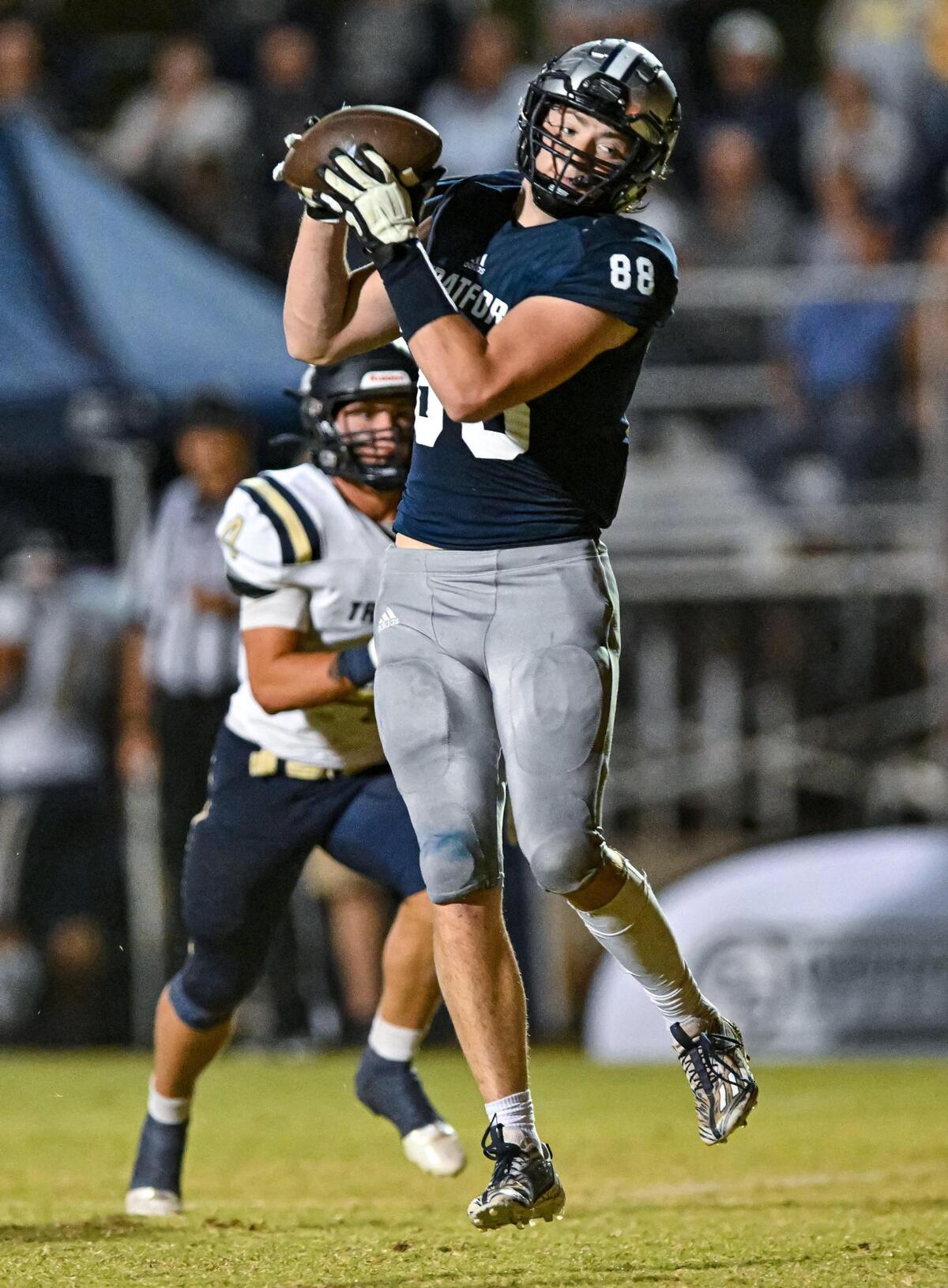 Stratford Eagle Eli Miscall hauls in a pass and heads for the endzone Friday night against John Milledge Academy.